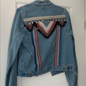 Denim jacket with fringe and Pom Pom details
